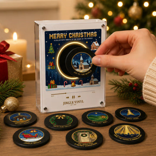 Mini vinyle de Noël posé sur le lecteur musical aimanté, avec les disques à côté